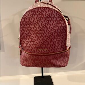 Michael Kors Rhea Medium Metallic Signature Logo Backpack in the color Cherry